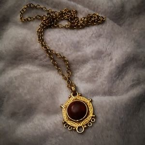 Gold tone necklace and pendant